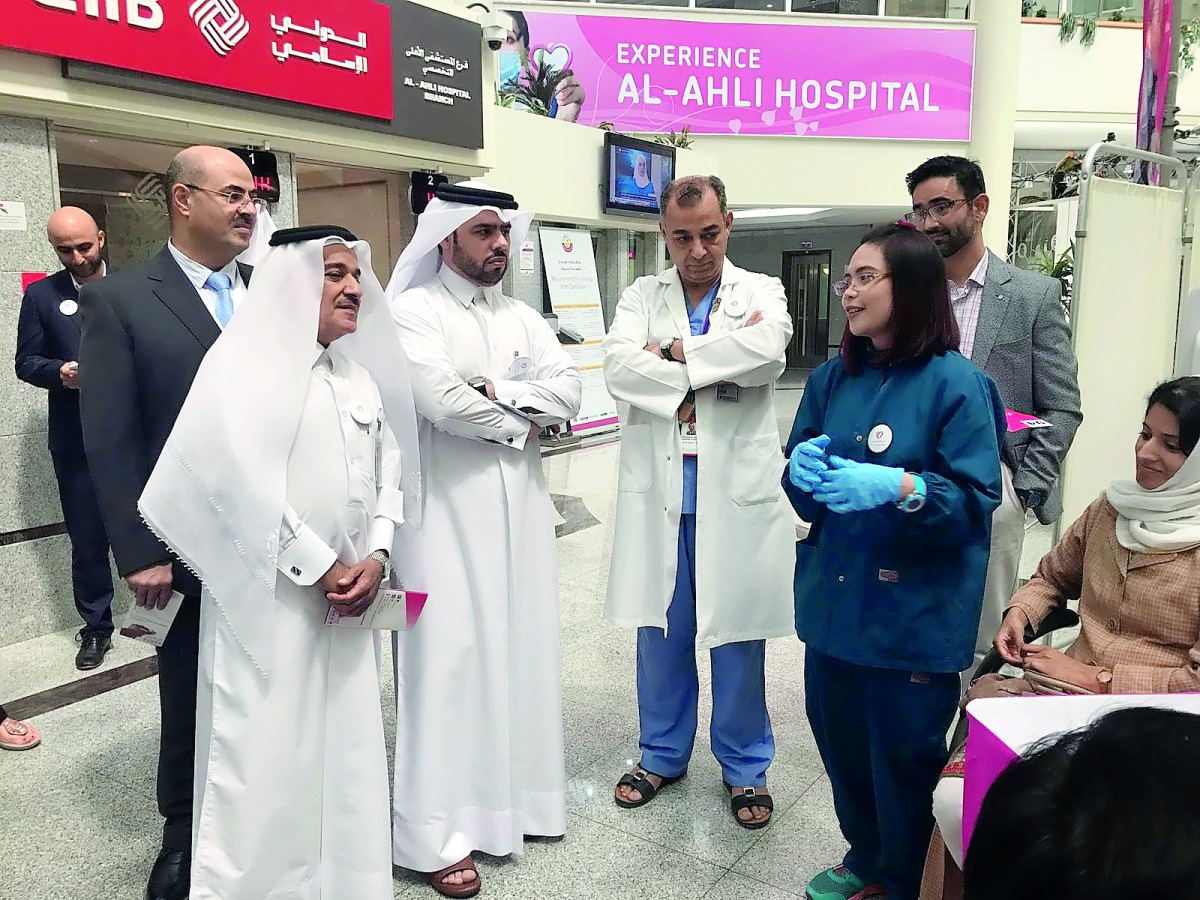 Al Ahli Hospital officials touring the stand of awareness activities held to promote cardiac health on Thursday at the hospital lobby.