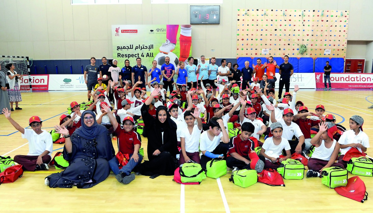 Sultana Afdhal, acting CEO of World Innovation Summit for Health; and Machaille Al Naimi, President of Community Development of Qatar Foundation, with the children and trainers at the end of Liverpool Football Club Foundation’s ‘Respect 4 All, Qatar’ trai