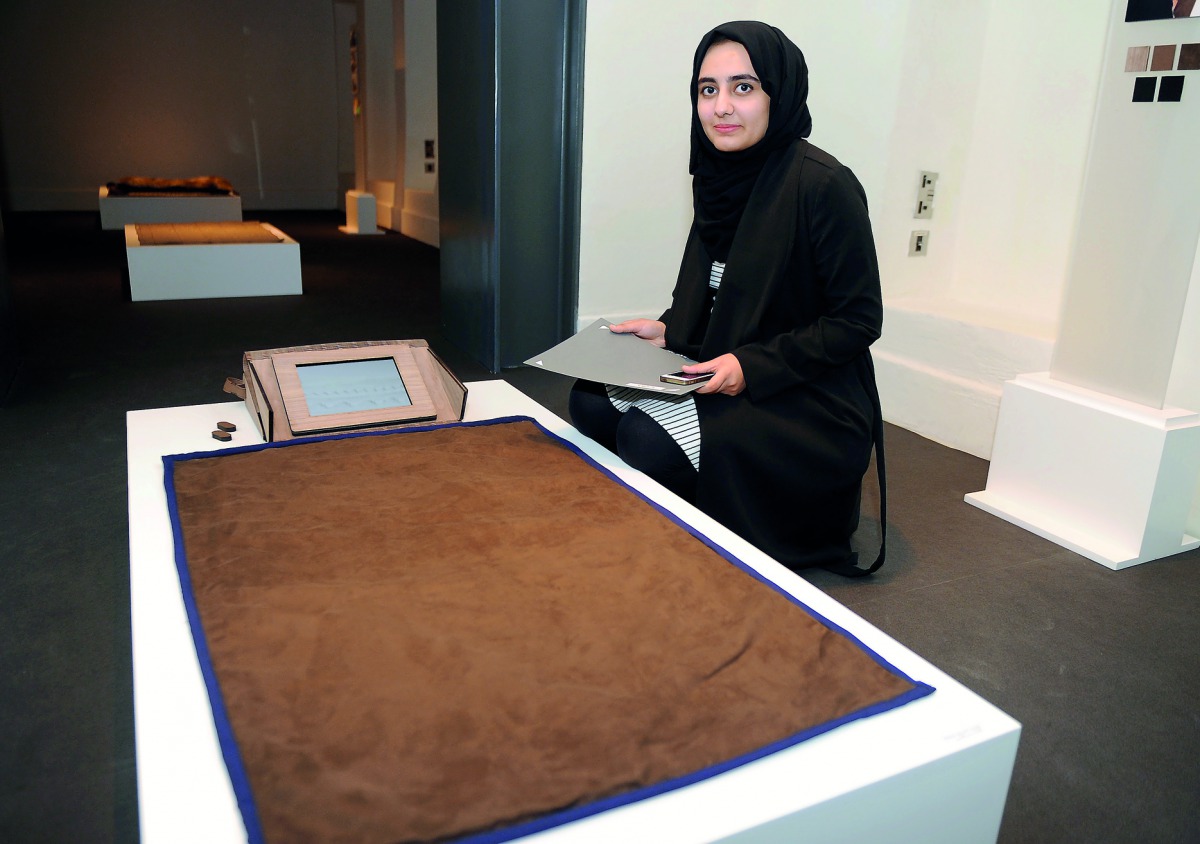 Sidra Sohail with her creation during the opening of the ‘Modern Prayer Rug’ exhibition at the Company House, part of Msheireb Museums in Msheireb Downtown, Doha. Pic: Abdul Basit / The Peninsula