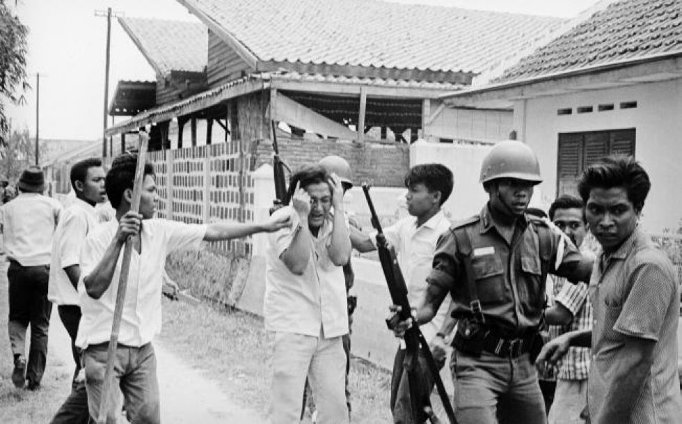 A Chinese student is attacked amid a purge in Jakarta in 1965 (Photo courtesy:  SCMP) 