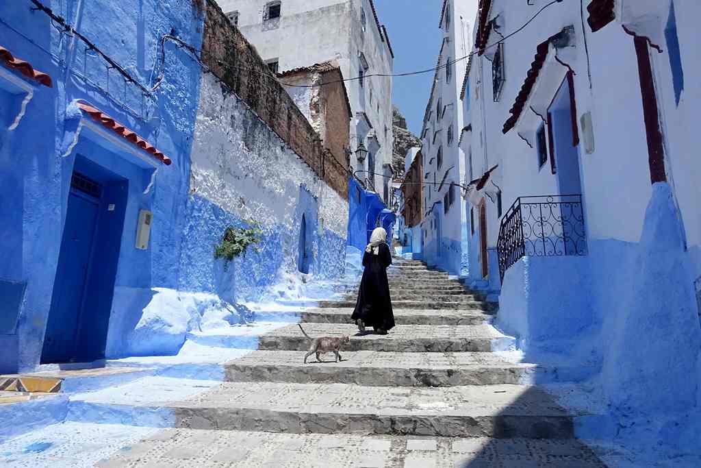 A Moroccan woman walks in Chefchaouen, in the northern Moroccan Rif region during the Muslim holy fasting month of Ramadan on June 21, 2017. AFP / EMILY IRVING-SWIFT
