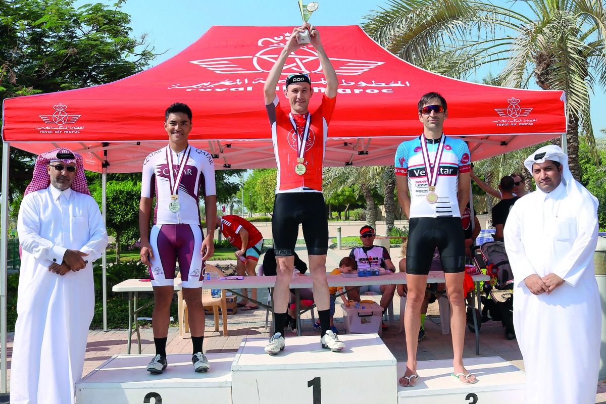 Team Velostar’s Tom Whateley (centre) celebrates on the podium after emerging victorious in Category A event. Qatari cyclist Mohamed Al Farizi (second left) won the silver medal while Whateley’s Velostar team-mate Fred Watson (second right) won the bronze