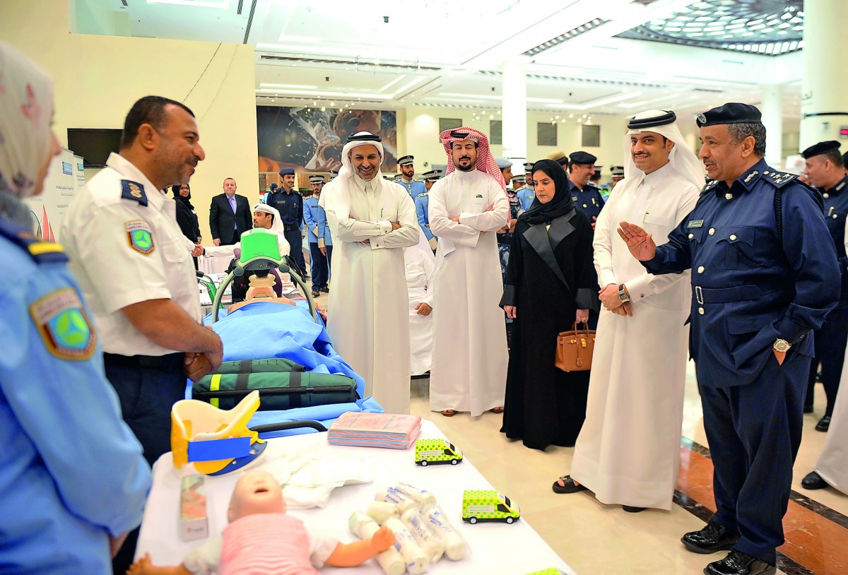 Brigadier Mohammed Saad Al Kharji, Director of the General Directorate of Traffic, and Sheikh Dr Mohammed bin Hamad Al Thani, Director of Public Health Department at the Ministry of Public Health with other officials at the event yesterday.  Pic: Baher Am