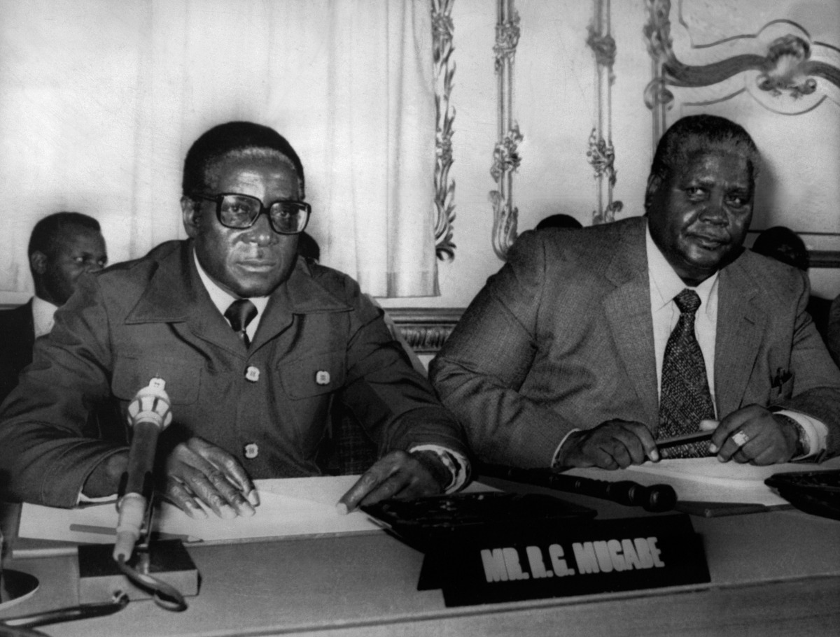 Patriotic Front leaders Robert Mugabe (L) and Joshua Nkomo (R) posing prior the opening of the British convened Rhodesian Constitutional Conference at Lancaster House, in London on September 10, 1979 AFP / UPI / Pete Skingley