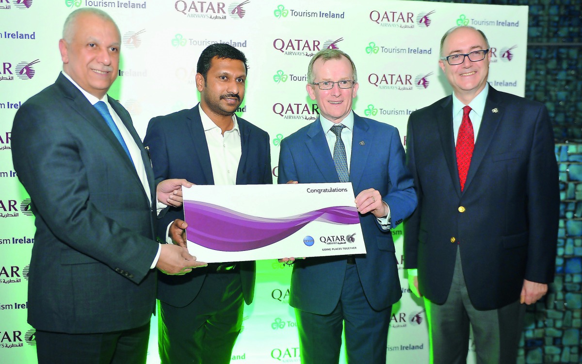 Ehab Abel Fattah Amin (left), Chief Commercial Officer at Qatar Airways; Niall Gibbons (second right), Chief Executive of Tourism Ireland; and Paul Kavanagh (right), Ambassador-Designate of Ireland to Qatar; awarding the winner of the ticket to Ireland du