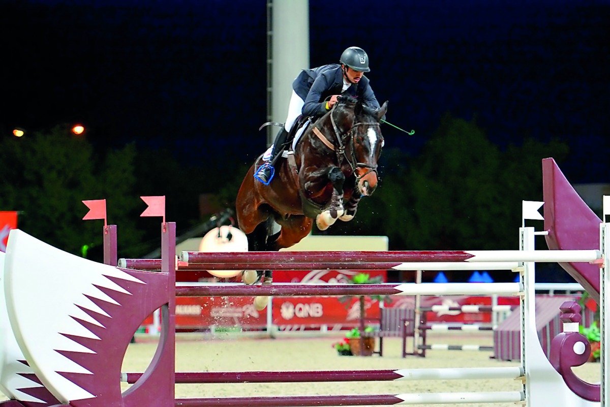 Rakan Al Hasawai guides his nine-year-old gelding Dennis over an obstacle during the 145cm event on the opening day of QNB Al Rayyan International Show Jumping Champions at QEF’s Outdoor Arena yesterday.