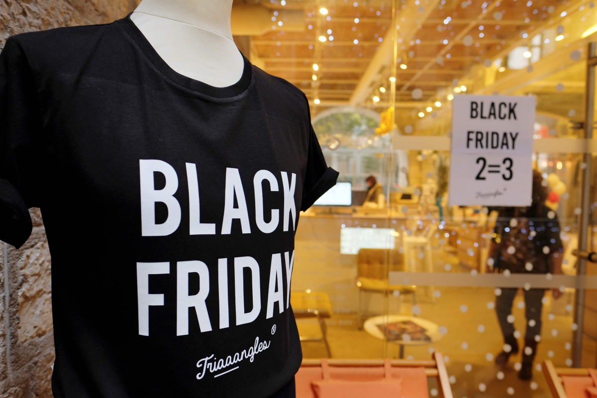 A photo shows a shop window where a poster announces Black Friday sales on November 24, 2017 in Marseille, southern France. AFP / Boris Horvat