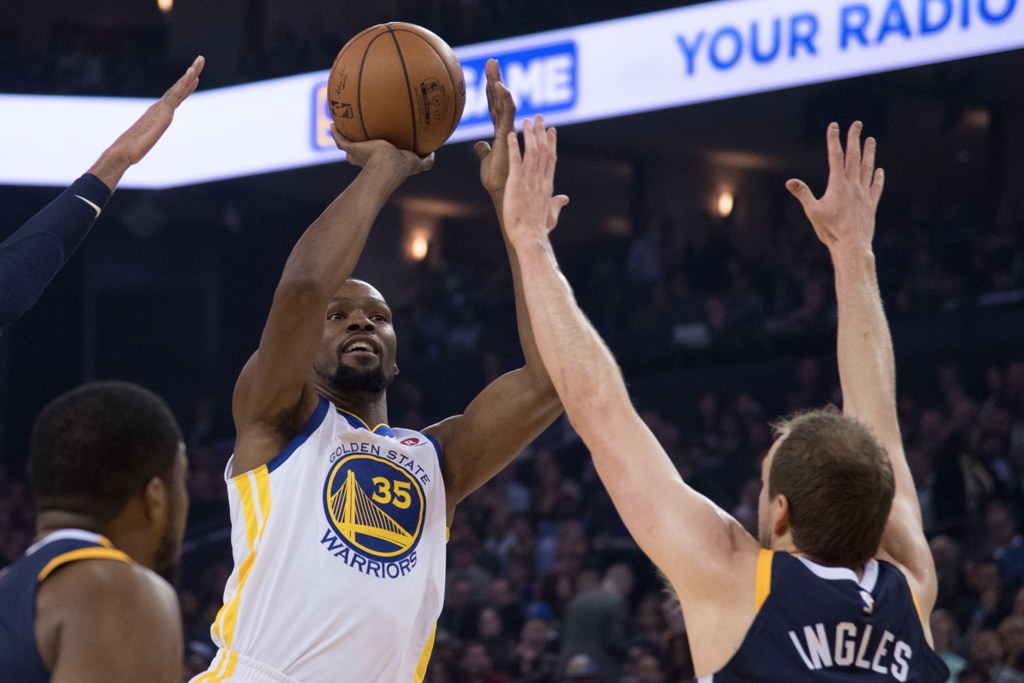 Golden State Warriors forward Kevin Durant (35) shoots the basketball against Utah Jazz forward Joe Ingles (2) during the first quarter at Oracle Arena. Mandatory Credit: Kyle Terada