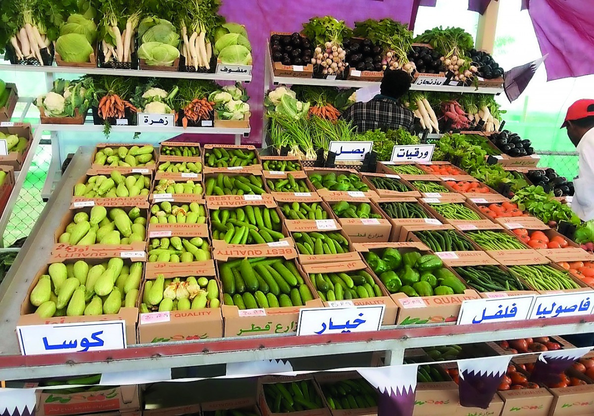 Locally produced vegetables are displayed in a market.