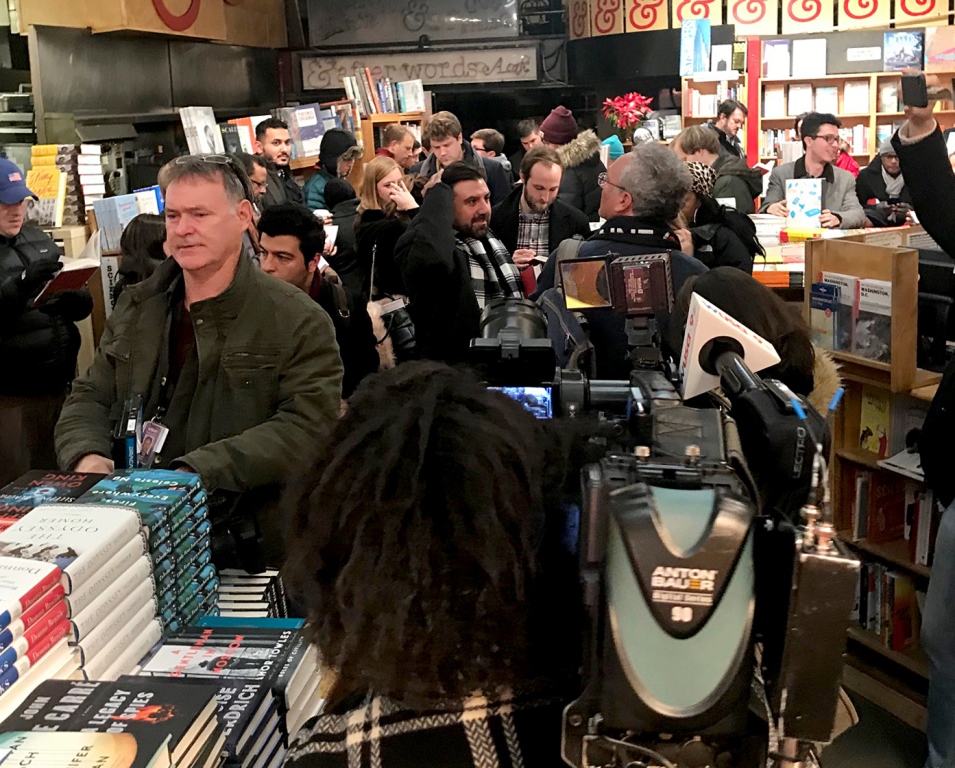 Customers line up at Kramerbooks late Thursday for the midnight sale of Michael Wolff's Trump White House book, 