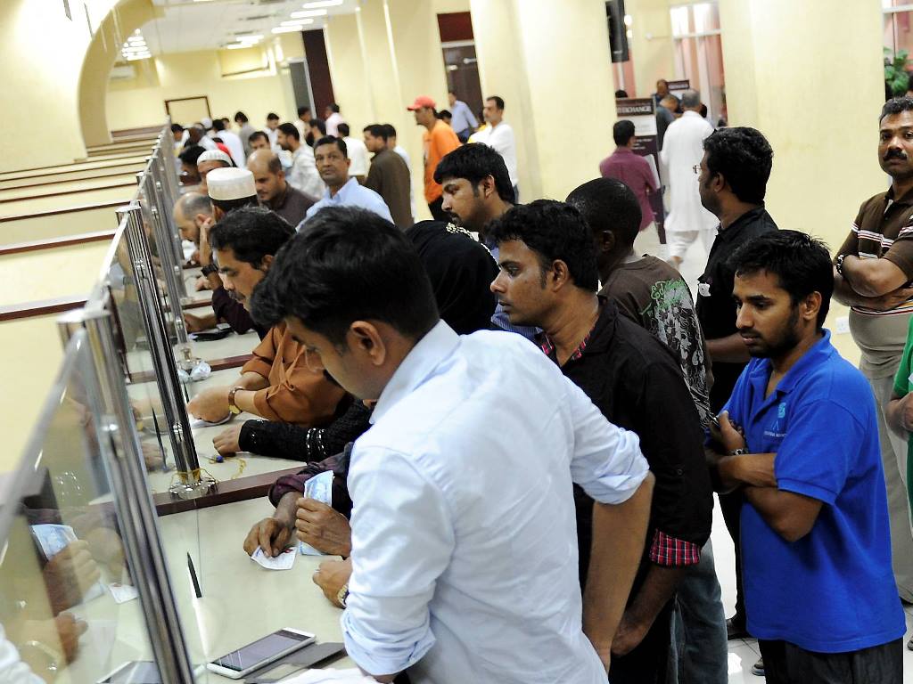 File picture of expats in queue at an exchange house in Doha. 