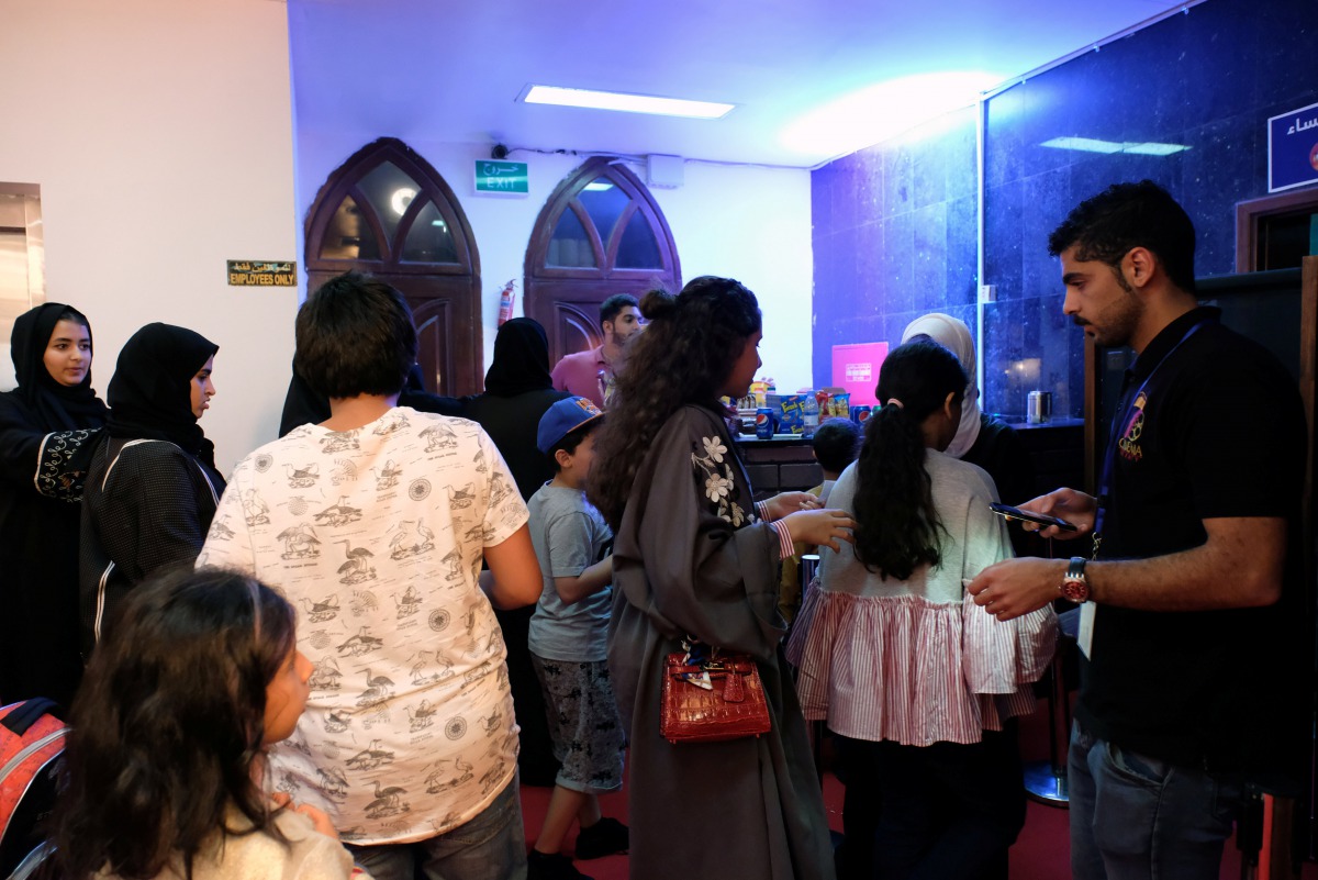 People arrive to first Saudi Arabia cinema in Jeddah, Saudi Arabia January 13, 2018. REUTERS/Reem Baeshen