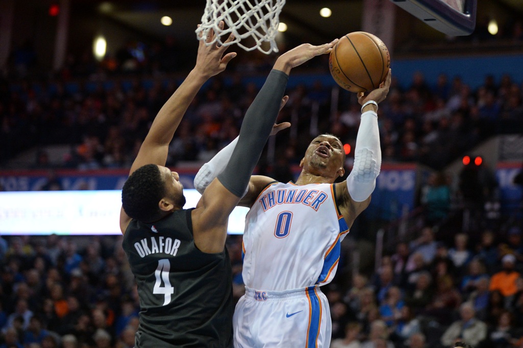 Brooklyn Nets center Jahlil Okafor (4) blocks a shot attempt by Oklahoma City Thunder guard Russell Westbrook (0) during the second quarter at Chesapeake Energy Arena. Mark D. Smith
