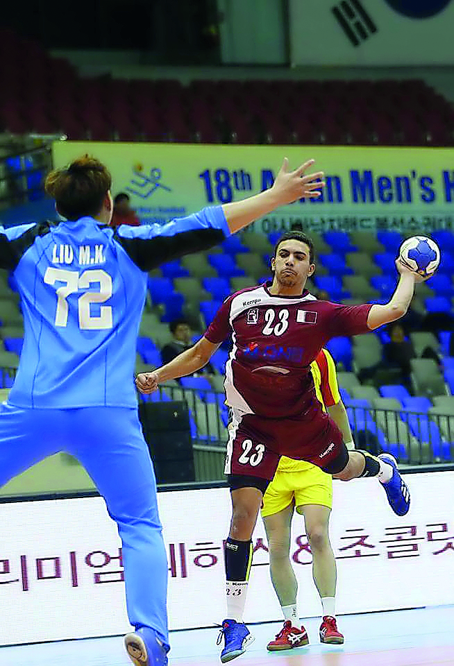 A Qatari player shoots at goal during the Asian Handball Championships in Suwon, South Korea.