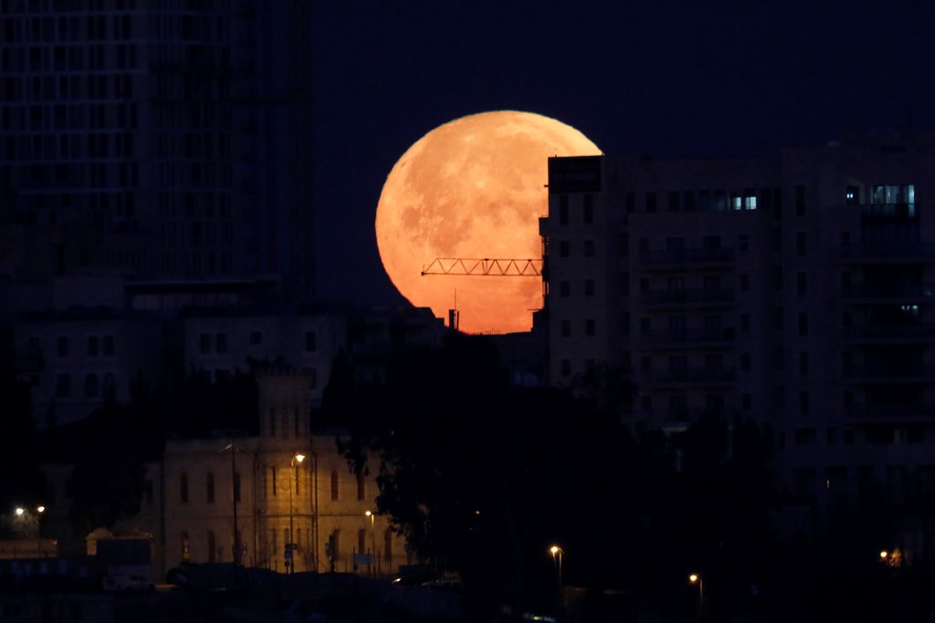 File photo of a 'Supermoon' rises above the old city of Jerusalem, Israel, 31 January 2018. EPA/ABIR SULTAN