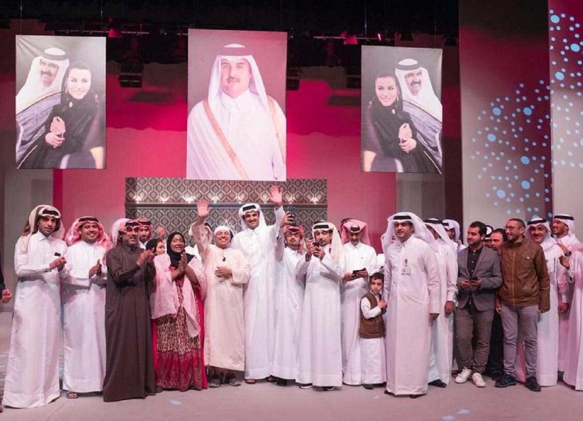 Emir on stage with the casts and crew of the play. 