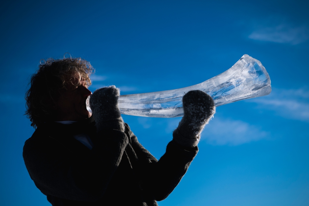 Terje Lsungset, the founder and artistic director of the Ice Music Festival, tests a musical instrument made of ice outside his workshop ahead of the festival on February 2, 2018 in the small mountain village of Finse in the municipality of Ulvik in south