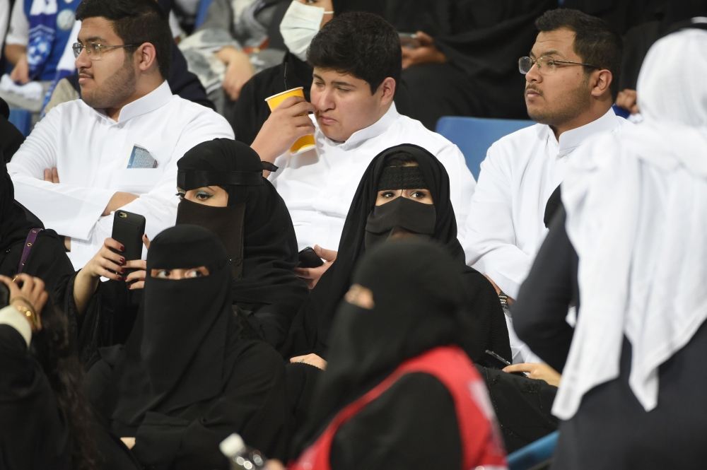 File picture of Saudi women and men at the AFC Champions League in Riyadh, on February 13, 2018. AFP / FAYEZ NURELDINE