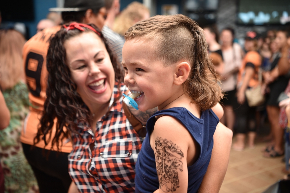 A child sports a mullet haircut at Mulletfest 2018 in the town of Kurri Kurri, 150 kms north of Sydney on February 24, 2018. AFP / PETER PARKS