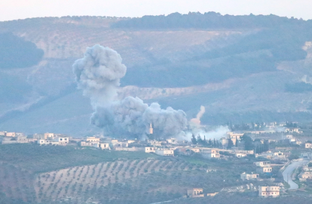 A photo taken from Turkey's Hatay province, on February 27, 2018 shows smoke rises after warplanes of Turkish Army Forces hit positions of PYD/PKK and Daesh terror groups across Hatay district within the 'Operation Olive Branch' launched in Syria's Afrin.