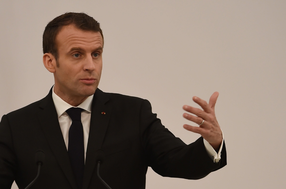 French President Emmanuel Macron addresses a press conference in the Indian city of Varanasi on March 12, 2018. AFP / MONEY SHARMA
