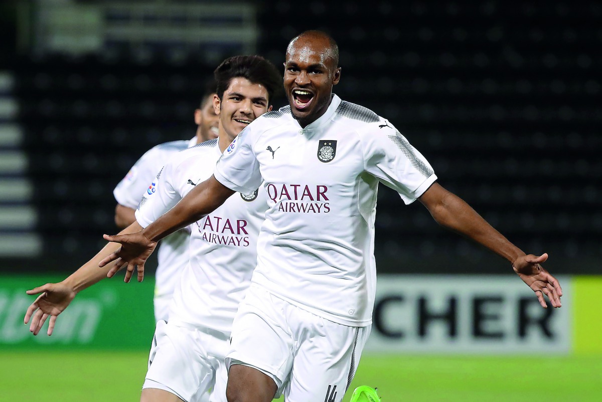 Al Sadd’s Abdelkarim Hassan celebrates after scoring a goal against Uzbekistan’s FC Nasaf in Doha yesterday. 