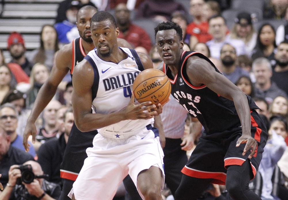 Toronto Raptors forward Serge Ibaka (9) and forward Pascal Siakam (43) defend against Dallas Mavericks forward Harrison Barnes (40) at the Air Canada Centre. Toronto defeated Dallas in overtime. John E. Sokolowski
