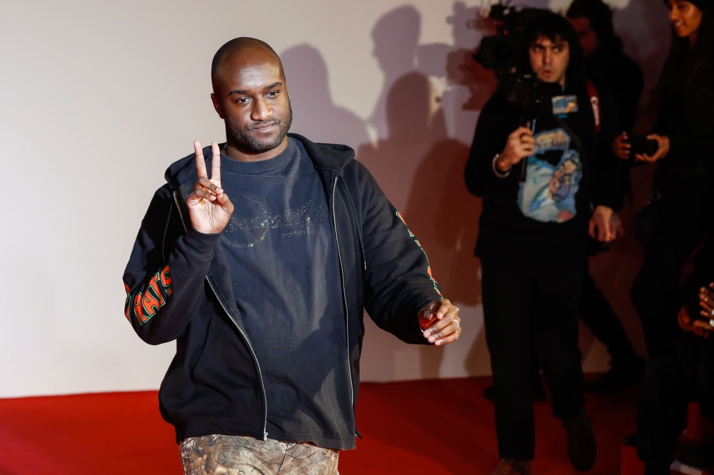 (FILES) In this file photo taken on January 17, 2018 US fashion designer Virgil Abloh acknowledges applause following the presentation of the men's Fall/Winter 2018/2019 collection he designed for Off White in Paris. AFP / FRANCOIS GUILLOT