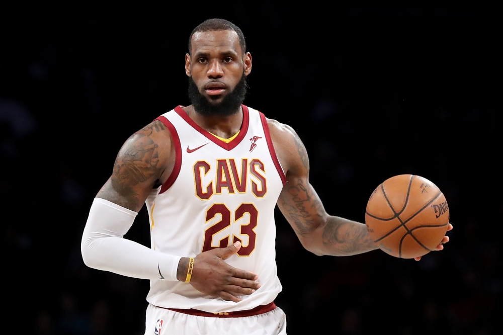 LeBron James #23 of the Cleveland Cavaliers dribbles down the court in the third quarter against the Brooklyn Nets during their game at Barclays Center on March 25, 2018 in the Brooklyn borough of New York City.   Abbie Parr/AFP
