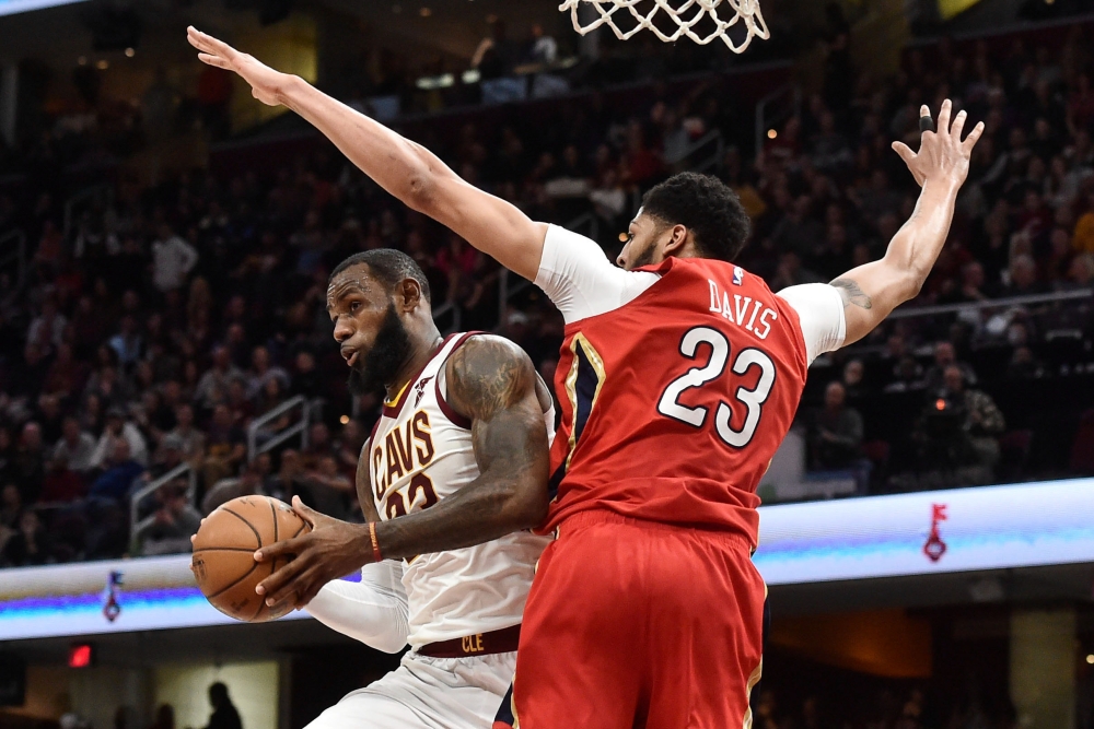 Cleveland Cavaliers forward LeBron James (23) drives to the basket against New Orleans Pelicans forward Anthony Davis (23) during the second half at Quicken Loans Arena. Ken Blaze
