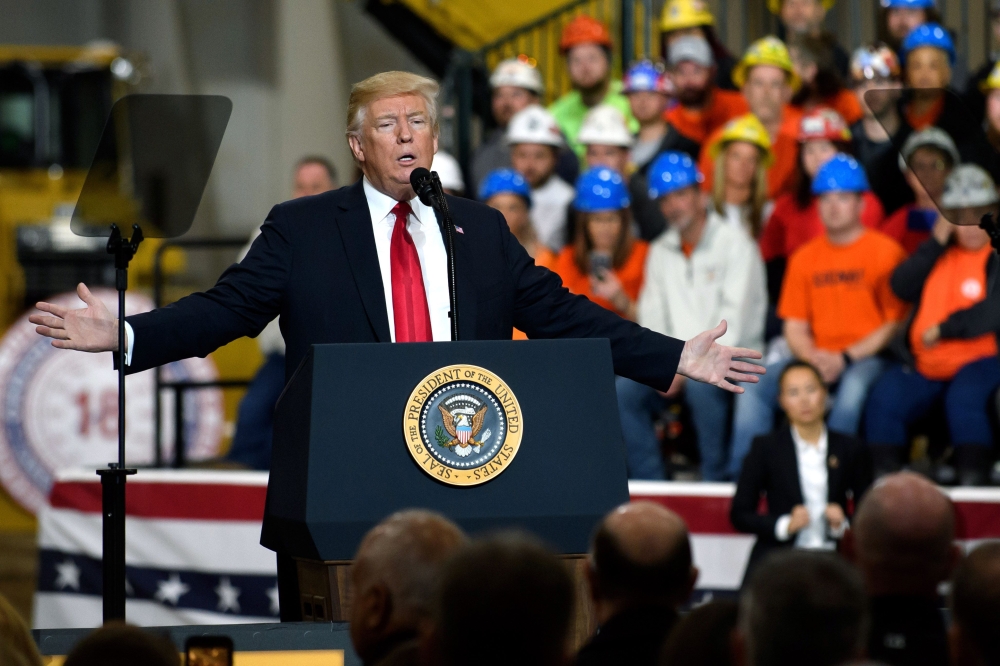 U.S. President Donald Trump speaks to a crowd gathered at the Local 18 Richfield Facility of the Operating Engineers Apprentice and Training, a union and apprentice training center specializing in the repair and operation of heavy equipment on March 29, 2