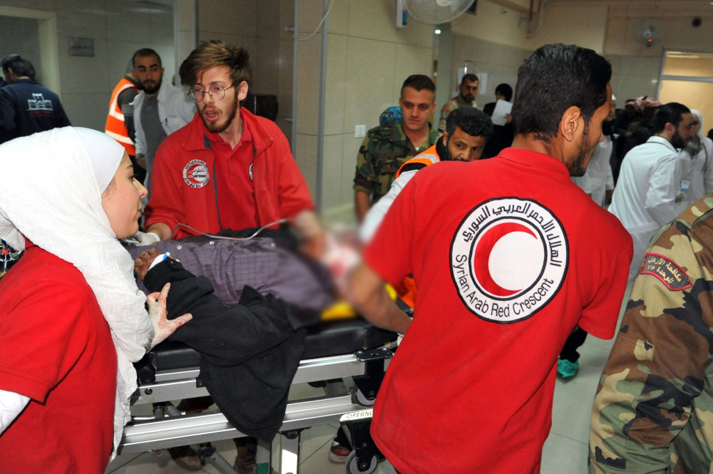 Wounded man arriving at a hospital in the Syrian capital Damascus, after rockets fired from Douma killed at least four civilians in various neighbourhoods across the capital. AFP / SANA