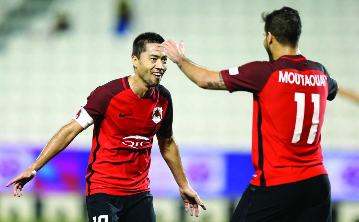 Al Rayyan’s Rodrigo Tabata (left) celebrates with a team-mate after scoring against Al Ahli yesterday.