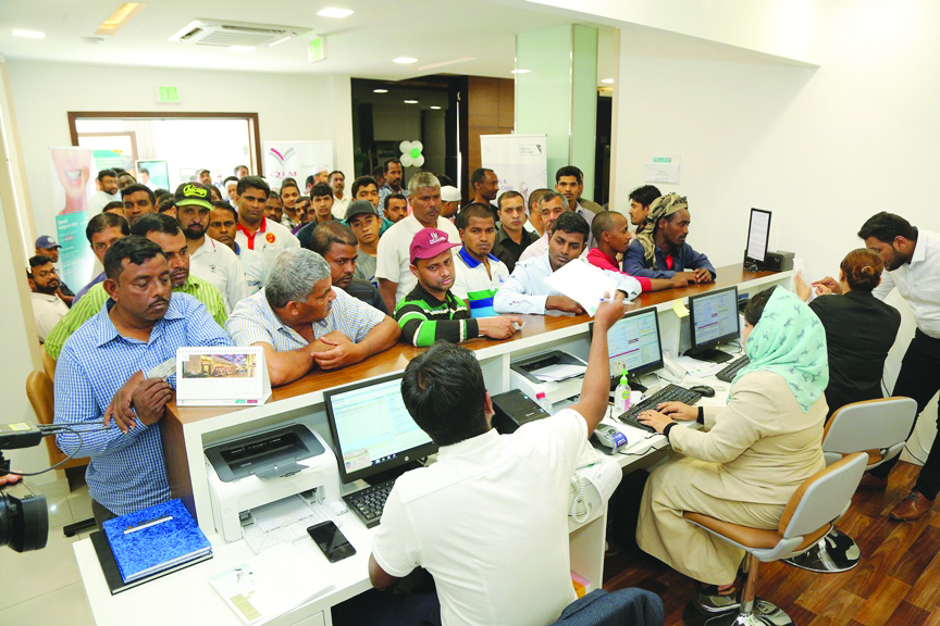 The crowd gathers at the registration desk during QLM’s free check-up event on Friday.