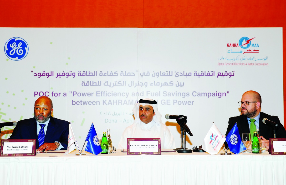 The President of Kahramaa, Essa bin Hilal Al Kuwari (centre), with President and CEO of GE Power, Russell Stokes (left), and Chargé d’Affaires, ad interim at the US Embassy in Qatar, Ryan Gliha during a signing ceremony in Doha yesterday. Pic: Salim Matra