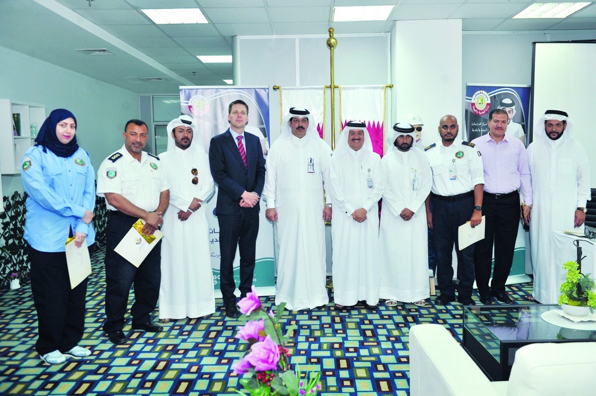 Mubarak Mohammed Al Buainain (fifth left), Assistant Director of Environmental Operations Department, Dr. Mohammed Bin Saif Al Kuwari, Director of the Center for Environmental and Municipal Studies and Saleh Al Marri, Assistant Technical Director at Hamad