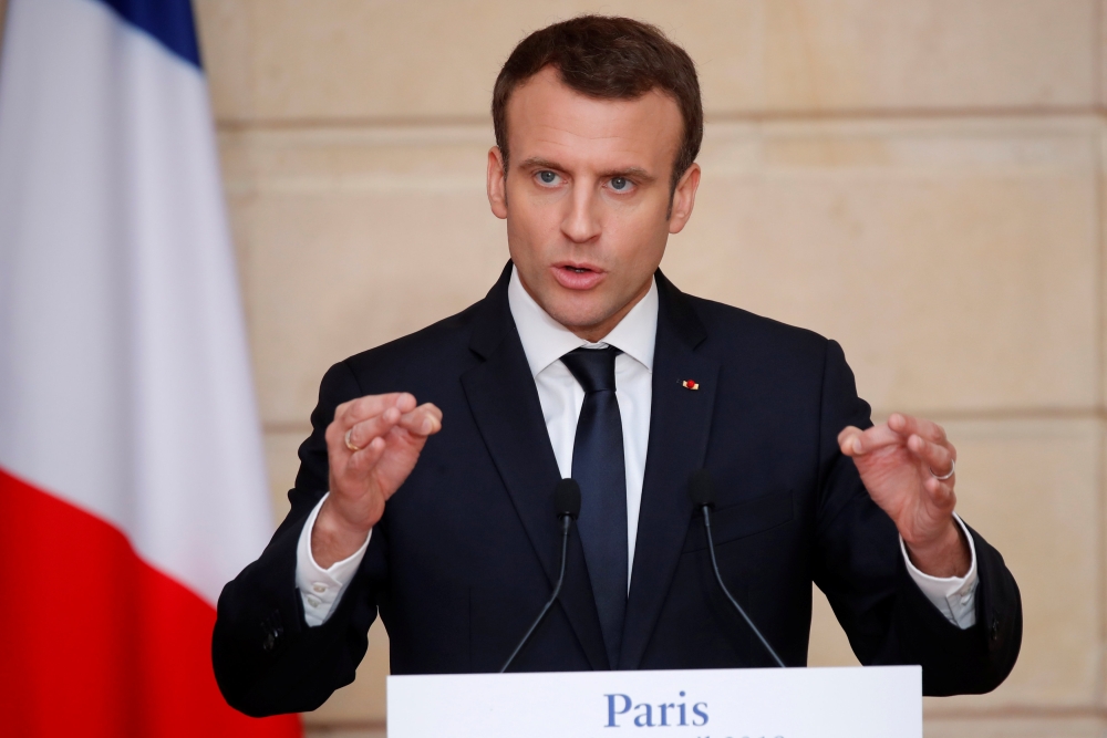 French President Emmanuel Macron speaks during a news conference at the Elysee Palace in Paris, France, April 16, 2018. REUTERS/Charles Platiau/Pool
