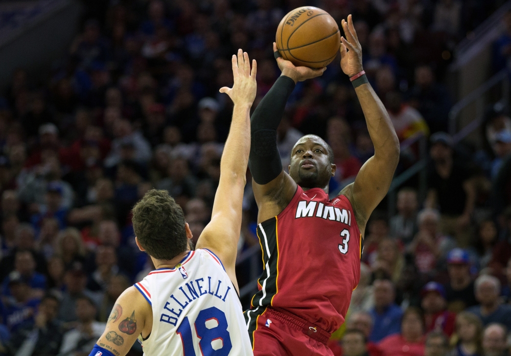 Miami Heat guard Dwyane Wade (3) shoots over Philadelphia 76ers guard Marco Belinelli (18) during the second quarter in game two of the first round of the 2018 NBA Playoffs at Wells Fargo Center.Bill Streicher
