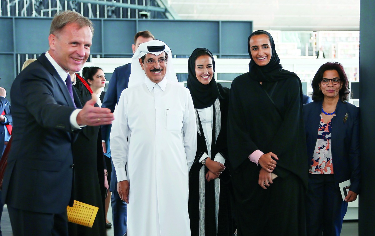 H E Sheikha Hind bint Hamad Al Thani, Vice-Chairperson and CEO of QF, and Minister of State H E Dr Hamad bin Abdulaziz Al Kawari with other dignitaries at the Heritage Library exhibition.