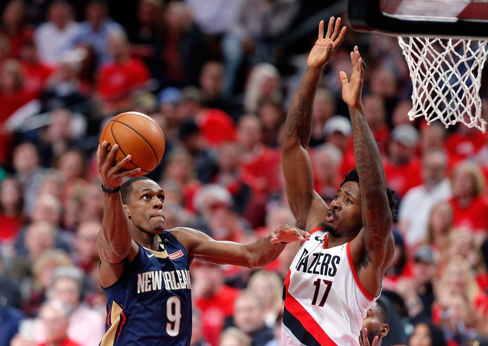 Rajon Rondo #9 of the New Orleans Pelicans drives against Ed Davis #17 of the Portland Trail Blazers during Game One of the Western Conference Quarterfinals during the 2018 NBA Playoffs at Moda Center on April 17, 2018 in Portland, Oregon. Jonathan Ferrey