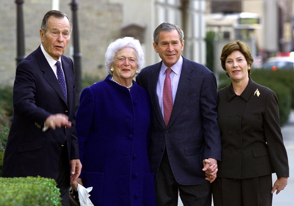 In this file photo taken on January 26, 2002 US President George W. Bush (2nd-R), his wife Laura (R), parents former US President George Herbert Walker Bush (L) and former first lady Barbara Bush (2nd L) as they leave St. John's Episcopal Church after Sun