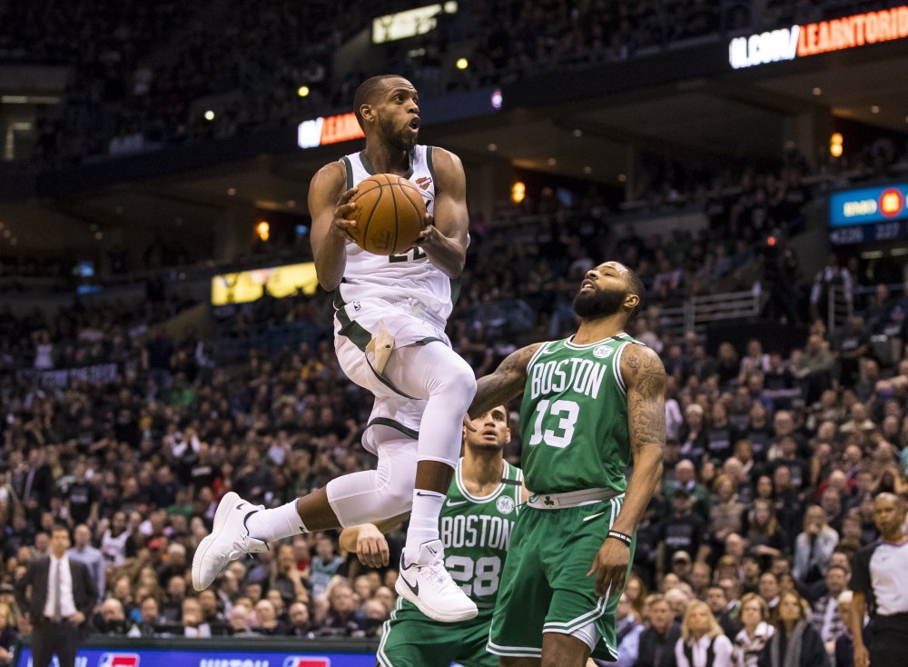 Milwaukee Bucks forward Khris Middleton (22) drives for a shot over Boston Celtics forward Marcus Morris (13) during the fourth quarter in game three of the first round of the 2018 NBA Playoffs at BMO Harris Bradley Center. Jeff Hanisch
