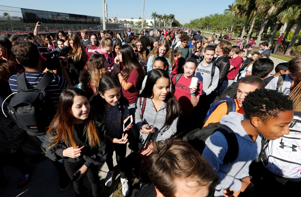 Students march to a park as part of a National School Walkout to honor the 17 students and staff members killed at the school in Parkland, Florida, March 14, 2018. (Reuters / Joe Skipper) 