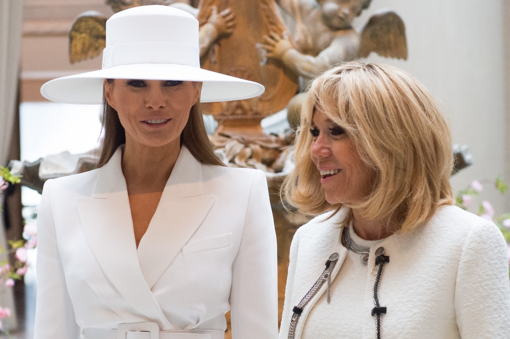 US First Lady Melania Trump and Brigitte Macron, wife of the French President, tour the National Gallery of Art in Washington, DC, April 24, 2018. AFP / Saul Loeb

