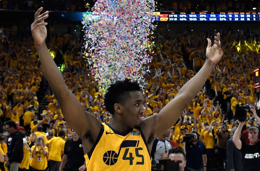 Donovan Mitchell #45 of the Utah Jazz celebrates the Jazz win at the end of Game Six of Round One of the 2018 NBA Playoffs against the Oklahoma City Thunder at Vivint Smart Home Arena on April 27, 2018 in Salt Lake City, Utah.   Gene Sweeney Jr./AFP 
