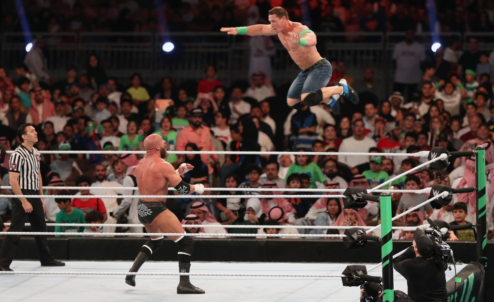 John Cena (R) competes with Triple H (L) during the World Wrestling Entertainment (WWE) Greatest Royal Rumble event in the Saudi coastal city of Jeddah on April 27, 2018. AFP