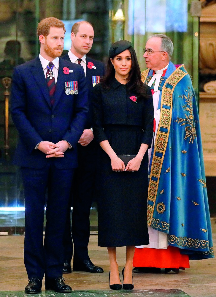 Britain’s Prince Harry (left), his US fiancee Meghan Markle (second right), Britain’s Prince William, Duke of Cambridge, (second left) and the Dean of Westminster John Hall during a service of commemoration and thanksgiving to mark Anzac Day in Westminste