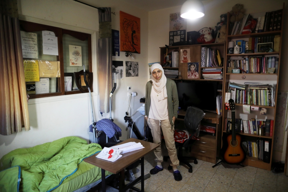 Arab-Israeli poet Dareen Tatour, 35, poses for a picture during an interview with Reuters at her house in Reineh, northern Israel September 26, 2017. Reuters/Ammar Awad