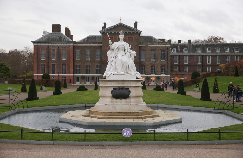 (FILES) In this file photo taken on November 27, 2017 A marble statue of Britain's Queen Victoria is pictured in the gardens of Kensington Palace in west London on November 27, 2017, following the announcement of the engagement of Britain's Prince Harry t