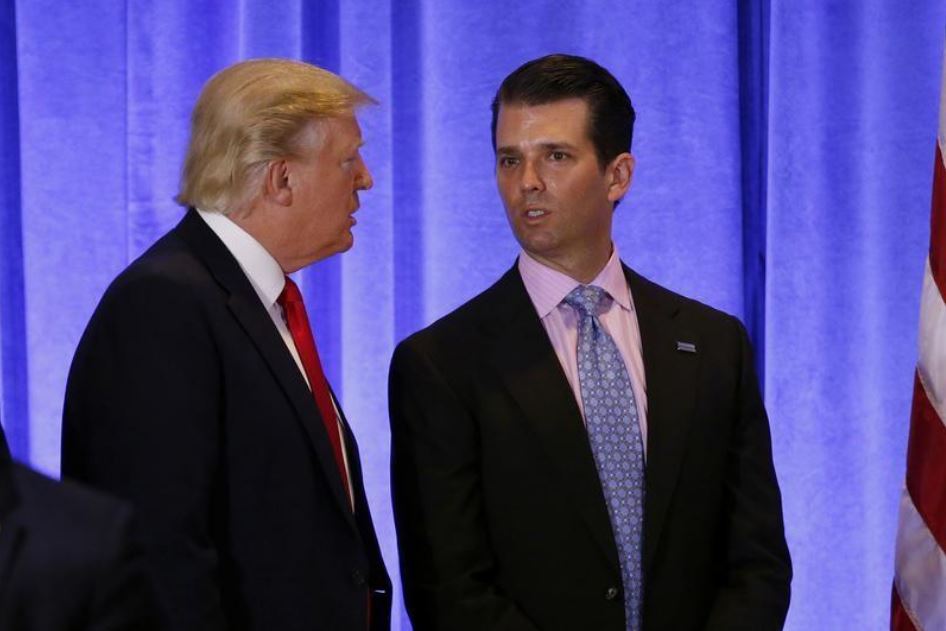 (FILE PHOTO) U.S. President Donald Trump speaks with his son Donald Trump Jr. in the lobby of Trump Tower in Manhattan, New York City, U.S., January 11, 2017. REUTERS/Lucas Jackson
